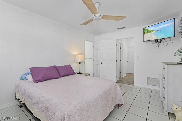 bedroom featuring light tile patterned flooring and ceiling fan