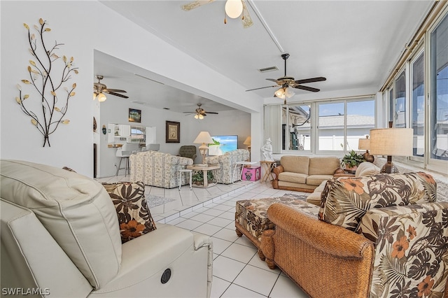 tiled living room featuring ceiling fan