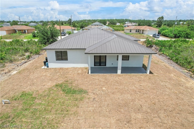 rear view of property with a patio