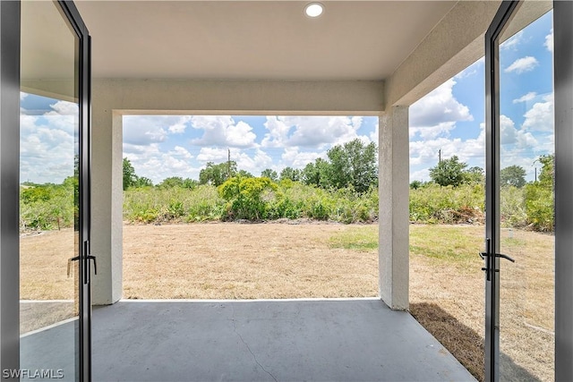 exterior space with concrete flooring and a wealth of natural light