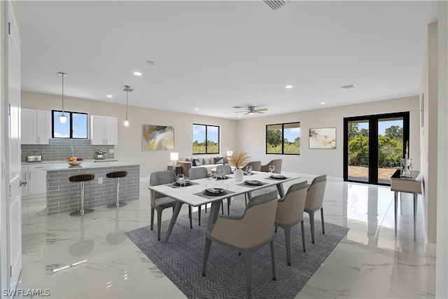 dining room featuring ceiling fan