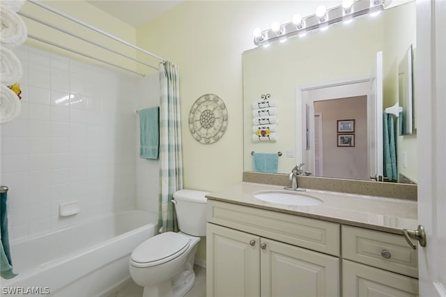 full bathroom featuring toilet, vanity, and tiled shower / bath combo