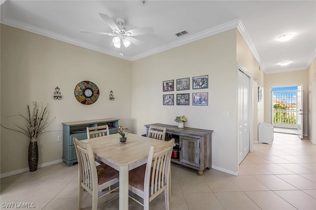 dining room with light tile patterned flooring, ceiling fan, and ornamental molding