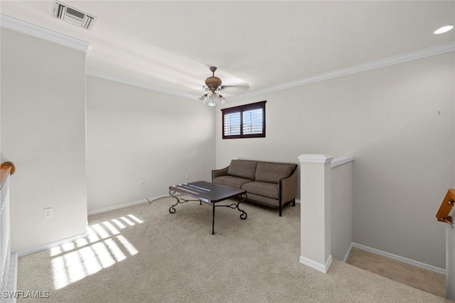 living room with crown molding, light carpet, and ceiling fan