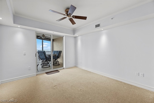 unfurnished living room featuring ceiling fan, crown molding, and carpet floors