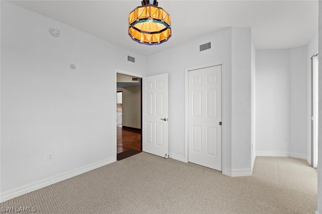 unfurnished bedroom with carpet floors