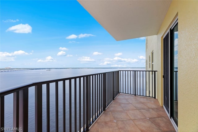 balcony featuring a water view