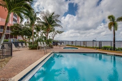 view of pool featuring a community hot tub