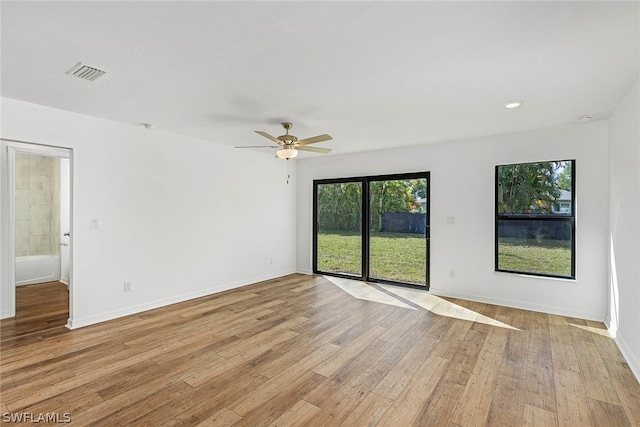 unfurnished room featuring ceiling fan and light hardwood / wood-style flooring