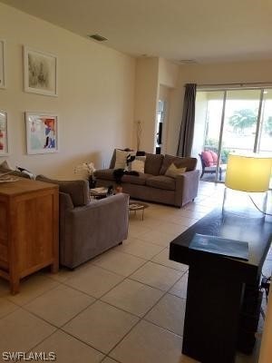 living room with light tile floors