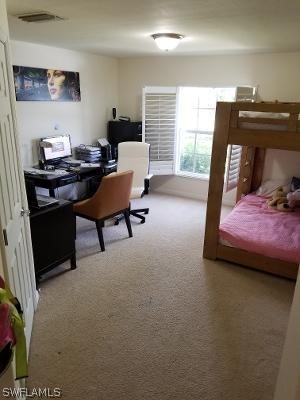 bedroom featuring carpet