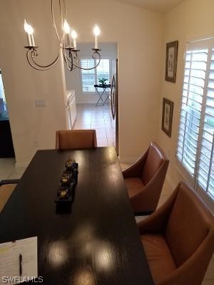 dining space with a healthy amount of sunlight and tile floors