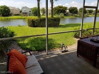 sunroom featuring a water view