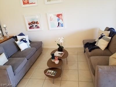 living room featuring light tile floors