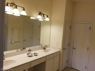 bathroom with dual vanity