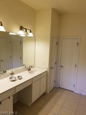 bathroom featuring vanity and tile flooring