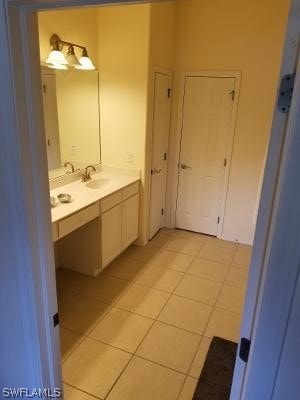 bathroom featuring vanity and tile flooring