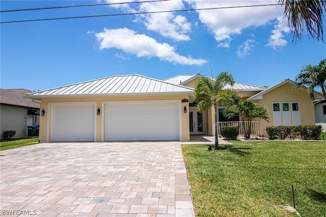 ranch-style home with a garage and a front yard