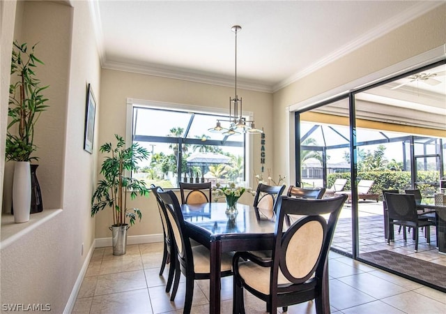 dining space with tile patterned flooring, a healthy amount of sunlight, and ornamental molding