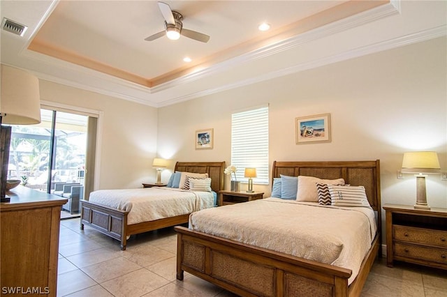 tiled bedroom with a raised ceiling, ceiling fan, ornamental molding, and access to outside