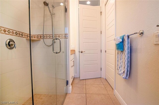 bathroom featuring tile patterned floors and walk in shower