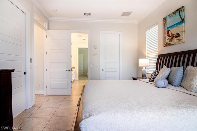 tiled bedroom featuring ornamental molding