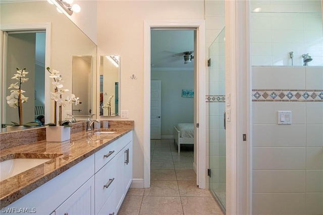 bathroom featuring tile patterned flooring, vanity, and ornamental molding