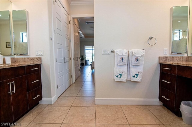 bathroom featuring tile patterned floors, vanity, and ornamental molding