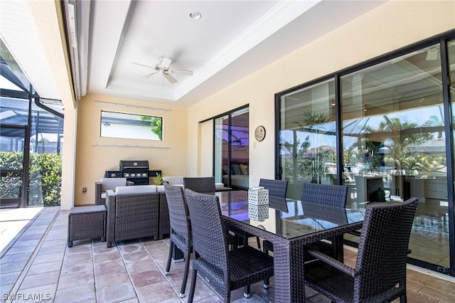 view of patio with glass enclosure and ceiling fan