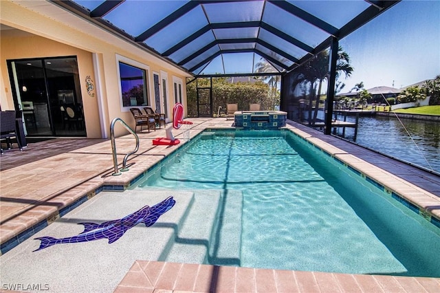 view of swimming pool featuring a lanai, a patio area, a water view, and an in ground hot tub