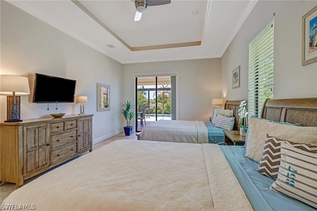 bedroom featuring access to outside, a raised ceiling, and ceiling fan