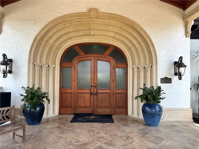 property entrance featuring french doors