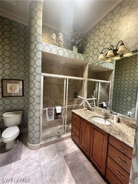 bathroom with a shower with door, crown molding, toilet, tile flooring, and vanity