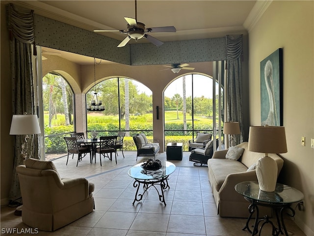 tiled living room featuring ornamental molding and ceiling fan