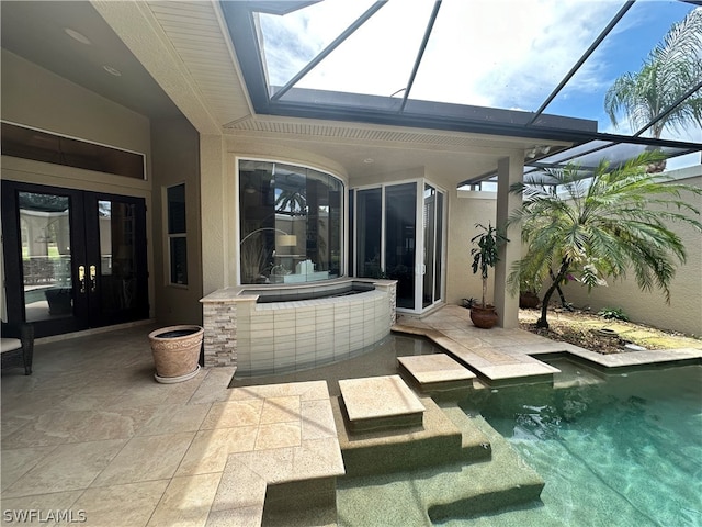 view of swimming pool featuring a patio area and a lanai