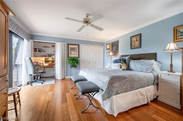 bedroom featuring a closet, light hardwood / wood-style floors, crown molding, and ceiling fan