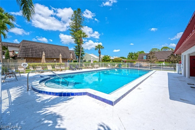 view of swimming pool featuring a patio