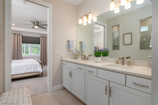 bathroom featuring tile flooring, oversized vanity, ceiling fan, and double sink