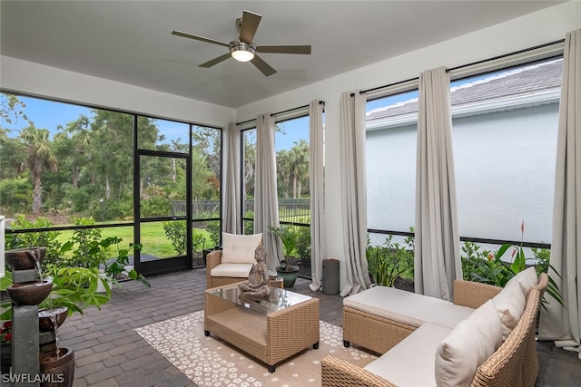 sunroom featuring plenty of natural light and ceiling fan