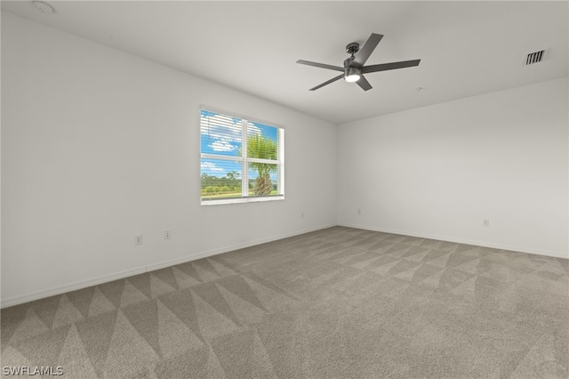 unfurnished room with ceiling fan and carpet floors