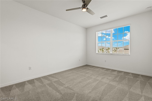 unfurnished room featuring carpet floors and ceiling fan