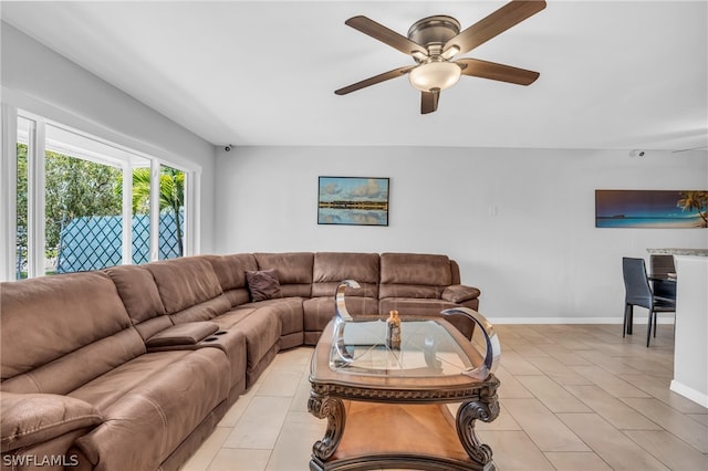 tiled living room featuring ceiling fan