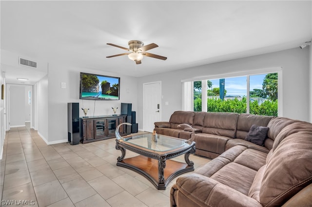 living room with ceiling fan and light tile floors