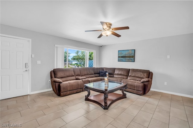 tiled living room featuring ceiling fan