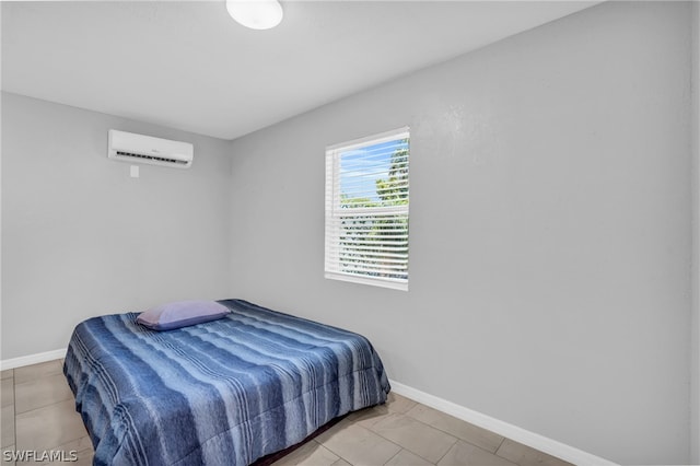 tiled bedroom with a wall mounted air conditioner