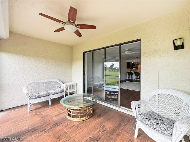 exterior space featuring hardwood / wood-style floors and ceiling fan