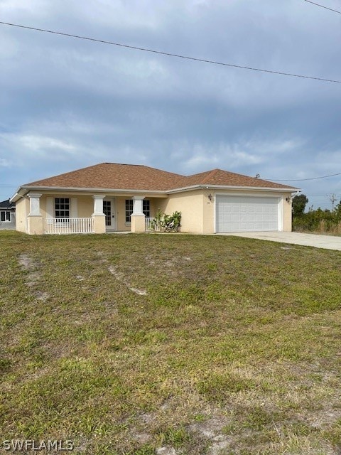 single story home featuring a garage and a front yard