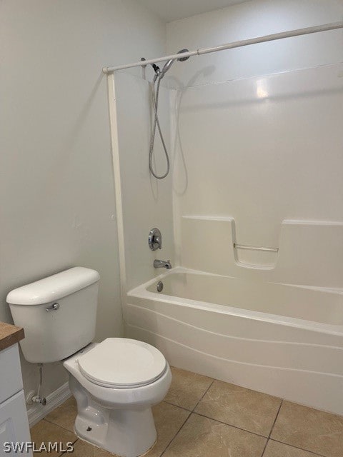 full bathroom with tile flooring, bathtub / shower combination, vanity, and toilet