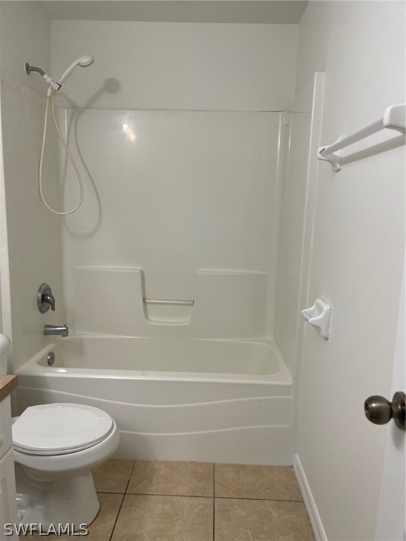 full bathroom featuring tile floors,  shower combination, vanity, and toilet