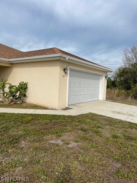 view of side of property featuring a garage